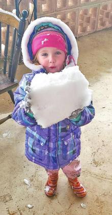 Kwyn Trent enjoys her first snowball.