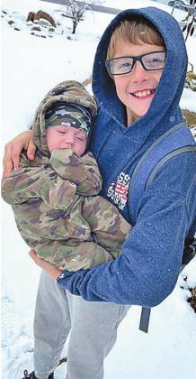 Pictured with big brother Jaxon, Kade Jones experiences snow for the first time.