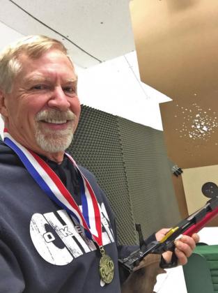 Ken Kliewer wearing his Gold Medal and holding the Air Pistol he won the Senior Division championship with at the 2020 Meijer State Games in August, just over a month ago.