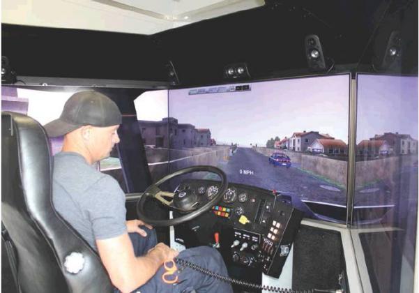 Cordell firefighter Jason Dudgeon demonstrates Western Technology Center’s driving simulator. Cordell fire department will be using the simulator to provide emergency response training to firefighters. Bob Henline | The Cordell Beacon