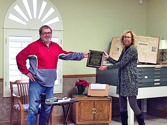 Pictured, Kathryn Carlisle, executive director presenting a plaque to Don Greteman. CONTRIBUTED PHOTO