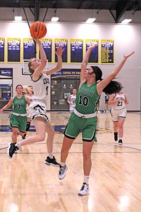 Senior Mckenzy Isbell pulls up for a layup. in a game vs. Leedey. PHOTO BY FLORA WALTERS