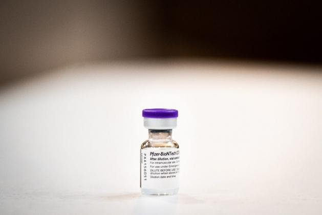 This vile of the COVID-19 Pfizer vaccine is said to contain five doses but health care workers say they can often get six doses by tapping the syringe to remove bubbles and carefully measuring each dose. (Whitney Bryen/Oklahoma Watch)