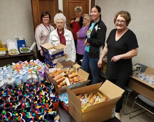 Foundation members gather to fill bags with goodies for teachers CONTRIBUTED PHOTO