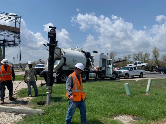Andy Archuleta’s Environmental Troubleshooters crew work to dig a hole with a hydrovac for the power line company to be able to set a new power line pole in place in Des Allemands in order to restore power. Hydrovacs are used to dig holes with water and suction to prevent any line strikes or accidental digging up of underground cables, water lines,gas lines,etc. PHOTO BY ANDY ARCHULETA