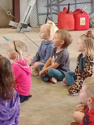 Students gather together to listen to what the Cordell Fire Fighters have to say.PHOTO BY HEATHER FLORES
