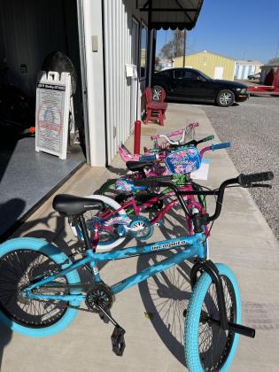 Donated bicycles are lined up shiny and ready to be delivered to area children this Christmas. PHOTOS BY BROOKLYNN PEEK