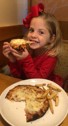 Sloane Roberts enjoys pizza!