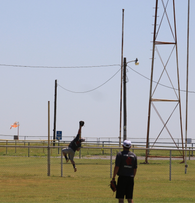 Donald Mitchell attempts to catch a homerun hit. Photo by Brooklynn Peek