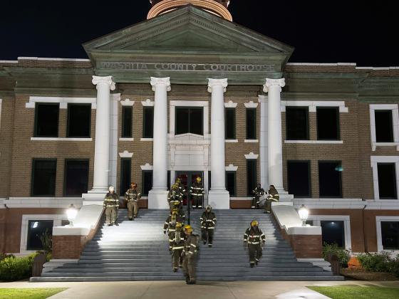 Local fire departments climb the equivalent of 110 flights of stairs at the Washita County Courthouse. Photo by Brooklynn Peek