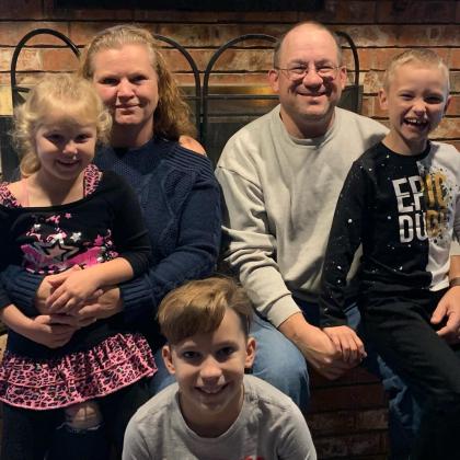 Sundae and Matt Schulte with their son Danny (center) and adopted children Jocelyn (left) and Jaxson (right) upon their adoption in November 2020