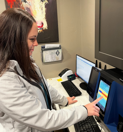 Dr. Devyn Weichel checks patients test results