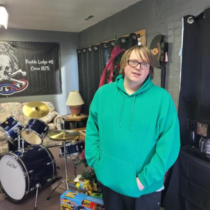 Contributed photo. Triston Jones stands in front of items donated to I.O.O.F Pueblo #8 Toy Drive.
