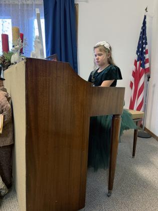 Elsie Jaronek performing a piece at the recital