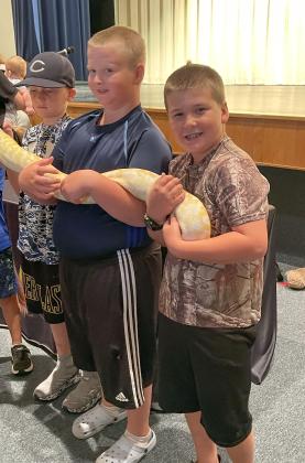 Cooper Reed, Josiah and Benaiah Miller with Banana the Burmese Python