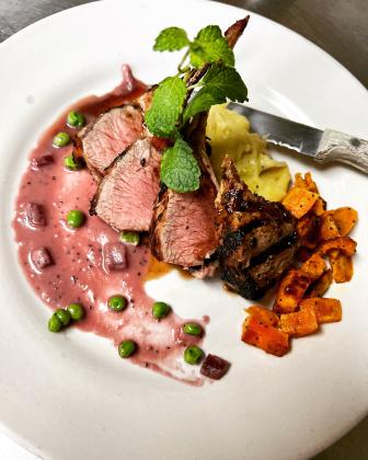 If Alex Thomison had to choose a dish that represents him, lamb chops might just be it. Served with a duchess potato, red wine beurre blanc, minted peas, and roasted sweet potatoes, the dish is packed with bold flavor and color.