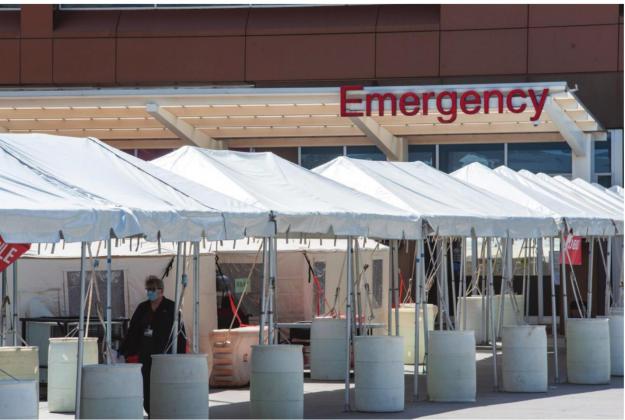 Tents are set up outside of the emergency room at OU Medical Center where patients are being evaluated before entering the building - one of the hospital’s new protocols prompted by the coronavirus outbreak. Whitney Bryen | Oklahoma Watch