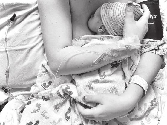 CONTRIBUTED PHOTO BY MARIAH HANSON Charity Walton holds her baby, Vincent, shortly after his birth. As the doula, Mariah Hanson provided emotional and physical support for Walton.