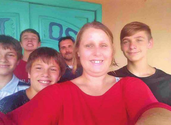 TOP: Mason Curnett sits in his hospital bed and tries to eat to keep his strength up. The teen has anaplastic large cell lymphoma. ABOVE: Mason and his family: front row, from left, Daniel and Dakota Harjo, mom Amber Vanskyper, Hayden Stout. Back row, from left: Mason and Jake Vanskyper. CONTRIBUTED PHOTOS