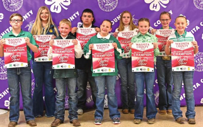 Washita County Junior Livestock Show Reserve Grand Champion Exhibitors L-R: Satcher Peck, Aubbri Johnston, Denton Cook, Blade Baldonado, Paisley Visnieski, Aubrey Sturgeon, Sayde Allen, Kinley Pruett and Emma Ray.