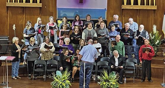 RIGHT: Community choir members rehearse ‘Come Worship the King’ CONTRIBUTED PHOTO