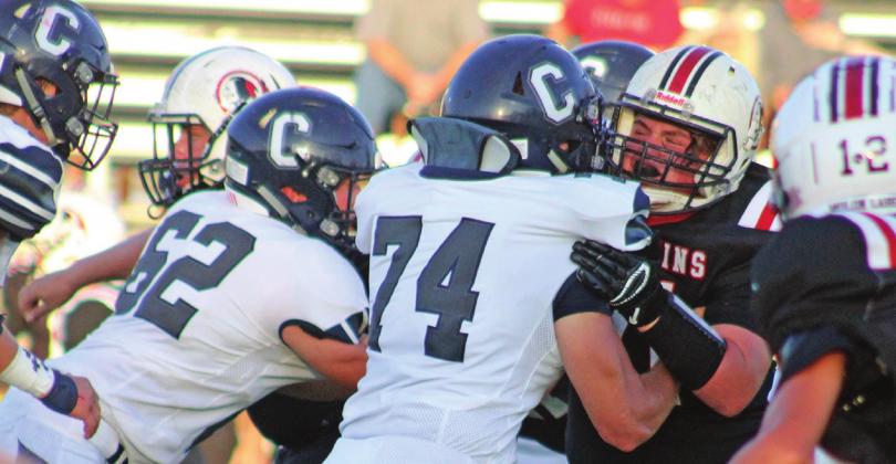 Linemen Cale McCoy and Gavin Jasmer work hard to take down some Redskins