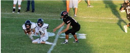 Parker Johnson recovers a Merritt fumble. Bob Henline | The Cordell Beacon