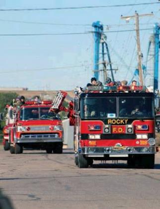 Cordell students arrive atop area fire engines. Bob Henline | The Cordell Beacon
