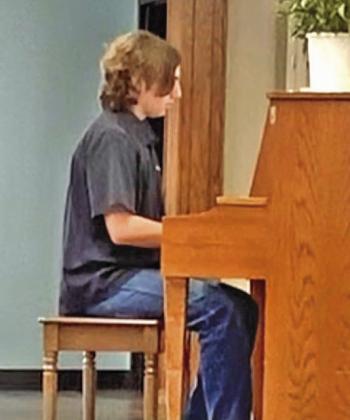 Archer Hill, Carnegie, plays at the Corn Heritage Village.