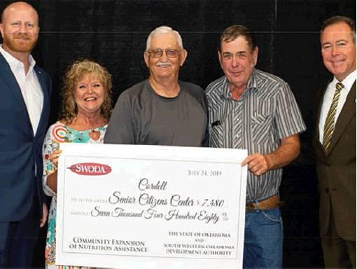 State Sen. Brent Howard, left, SWODA board member Edie Brown, Keith Young (Cordell Senior Citizens Center), SWODA board member Leo Goerginger, and State Rep. Todd Russ during the CENA grant presentation July 24, 2019. Photo courtesy of Mary Peck, SWODA.
