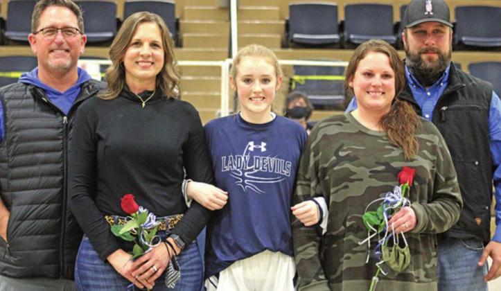 McKenzy Isbell, escorted by Jon and Becky Phillips and Levi and Anna Feltman