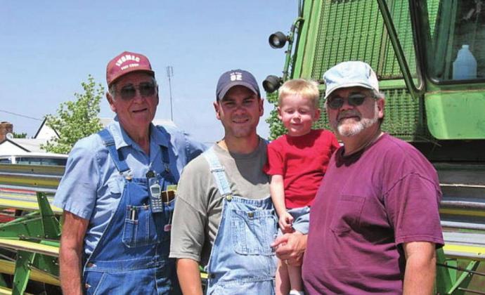 Four generations of Johnsons at the farm. L to R-Earnest Johnson, Chris Johnson, Parker Johnson, and Elmer Johnson.