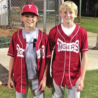 Dane Corbin (left) and Parker Johnson (right) pose for a picture after a hard fought baseball game, back when the pair played for the Mountain View Tigers.