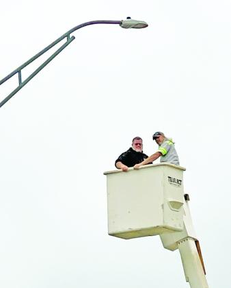 Dustin Pool and Troy Lee with the City of Cordell helped complete the changeover of Cordell’s street lights to LED fixtures, which are much more reliable and energy-efficient than the old conventional lighting. In addition to energy savings, converting to LED lights improves illumination, enhancing safety. LED lamps require far less maintenance as they do not require regular replacements. PHOTO BY BROOKLYNN PEEK
