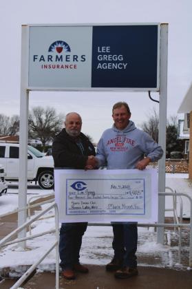 Monte Nickel, right, with the Cordell All Sports Booster Club, presents the symbolic check for the club&amp;#x2019;s reverse lottery to Lee Gregg. Bob Henline | The Cordell Beacon