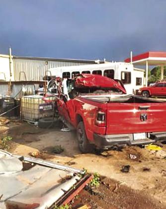 Damaged vehicles sit outside Gatlin’s Garage, one of the hard-hit businesses PHOTO BY TRISTAN WILLIAMS
