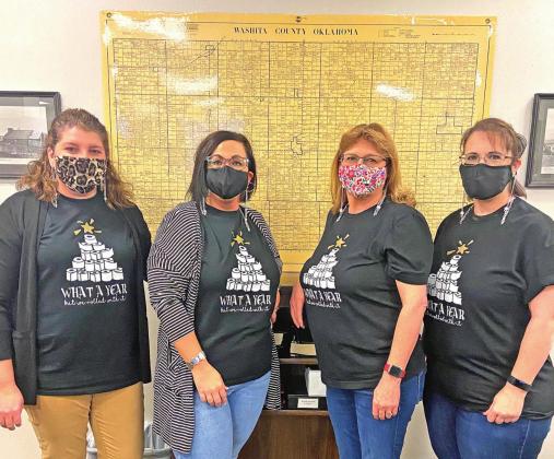 Kristen Dowell, Misty Holman, Sue Fletcher and Kim Bryan show off their masks and T-shirts proclaiming they survived 2020.