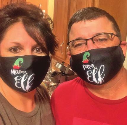 Sheri and Manny Parsons show a little Christmas spirit.