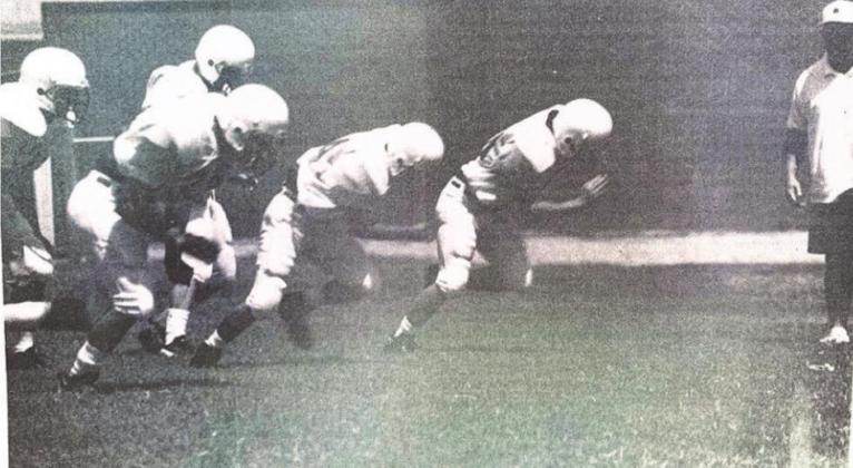 CHS Head Coach Raymond Cole (far right) kept a watchful eye over Blue Devil players ad the team prepared for the new season.