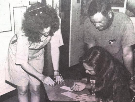 Cordell Junior High student Sara Cornell got class scheduling help from her dad, William Cornell, and teacher Rosemary Dic. The first day of classes was Wednesday, August 16.