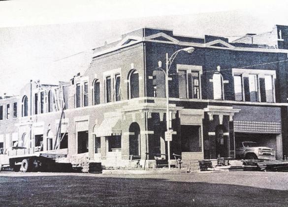 A Cordell landmark - the old Farmers National Bank building, was coming down to make way for an attractively landscaped parking lot to serve the bank in its new location across the alley to the south. The space at the lower right (where the truck was parked) was formerly occupied by Chamlee Drug Store, which moved to a new building the previous year.