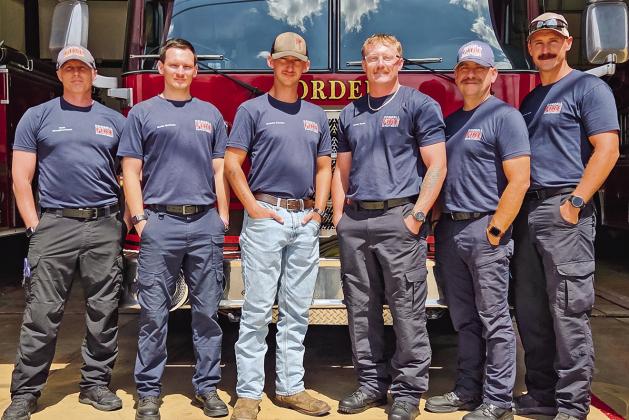 Fire Chief Seth Slaughterback, newly hired trio Devin Wedman, Gabriel Stacker, and Saxon Poole, EMS Director Mike Morel, and Easton Page