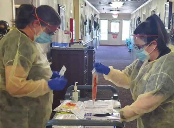 Staff wearing protective gear work at an eastern Oklahoma nursing home.(Photo provided)