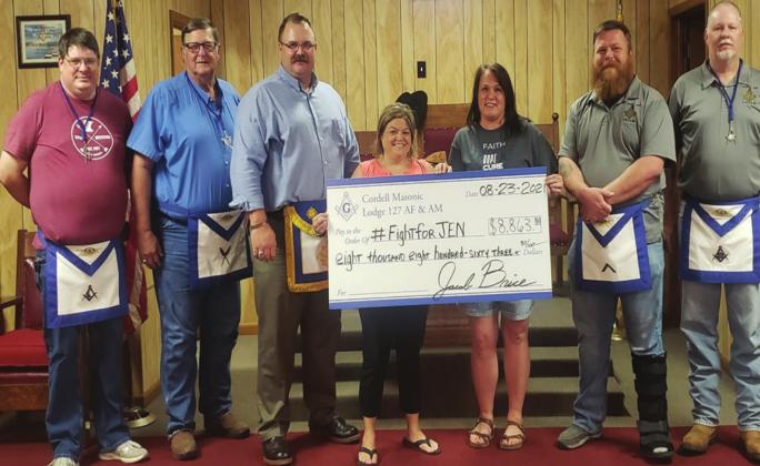 Members of the Cordell Masonic Lodge and one of the #FightForJen softball tournament organizers gather together to present Jennifer Cary with her $8,863.80 check to help her with her cancer treatment. From Left to right: Kerry Fitch, Dirk Webb, Landon Jones, Jennifer Cary, Toni Lesley, Jacob Brice, and Mike Weixel. CONTRIBUTED PHOTO