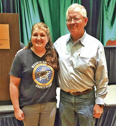 Washita County Clerk Kristen Dowell, current County Officers and Deputies Association President, and outgoing President Gary Stams of Pontotoc County.