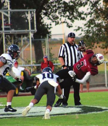 Cordell junior Raydon Kuehne brings down a Watonga running back, second place in the Oklahoma Press Association sports photography category.
