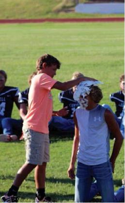 Football Players, Cheerleaders Take One For The Team