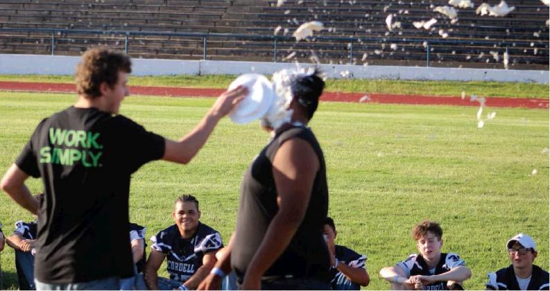Football Players, Cheerleaders Take One For The Team