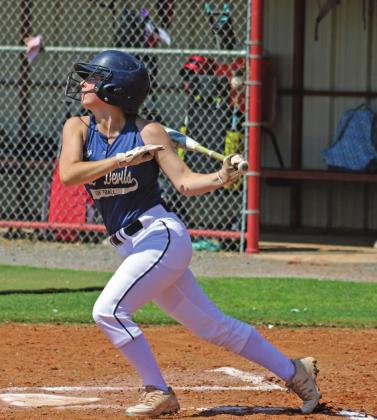 Junior Kenlee Dodd takes off after hitting the ball