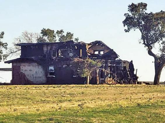 Fire destroys structure; quick response prevents spread